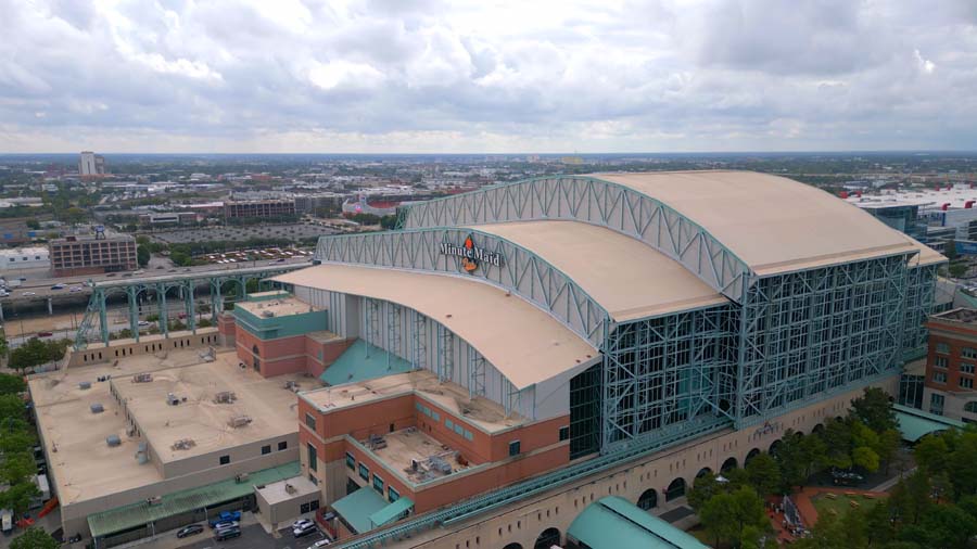 Aerial view of Minute Maid Park, home to the Houston Astros, with its retractable roof and surrounding area.