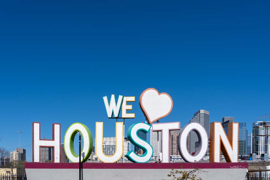 Signage of The University of Texas MD Anderson Cancer Center, a leading cancer treatment and research facility.